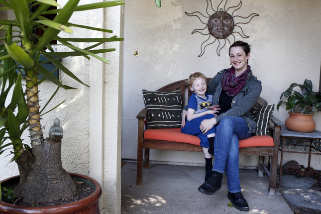Angela Hockabout is photographed with one of her two kids Nate, 5, at the house of her mother in-law in Alameda, Calif., on Friday, April 3, 2015. The